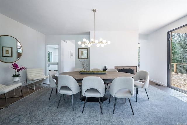 dining area with an inviting chandelier