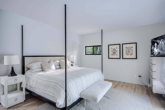 bedroom with wood-type flooring