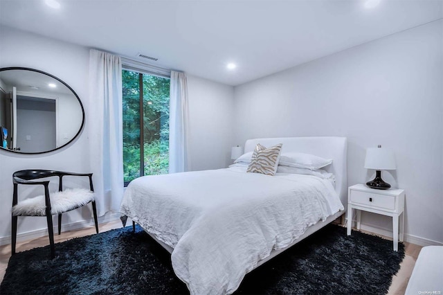 bedroom with wood-type flooring