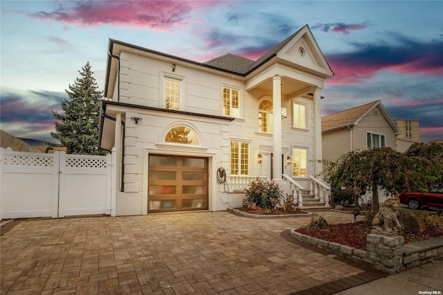 greek revival house with a garage