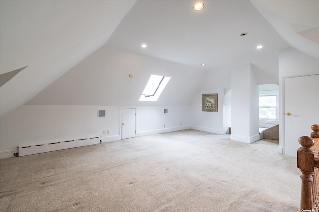 26-44 211th St, Bayside, NY 11360 - additional living space with a baseboard heating unit, vaulted ceiling, a skylight, light colored carpet, and baseboards