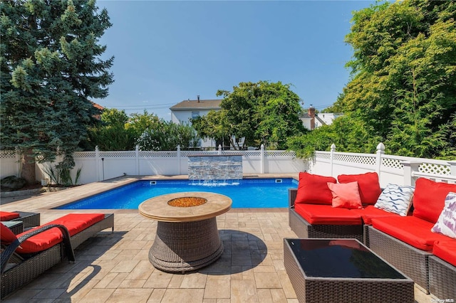 view of swimming pool with a patio area, pool water feature, and an outdoor hangout area