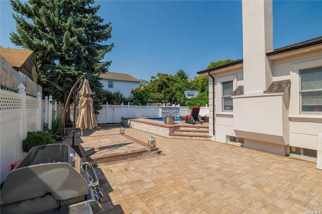 view of patio / terrace featuring a pool