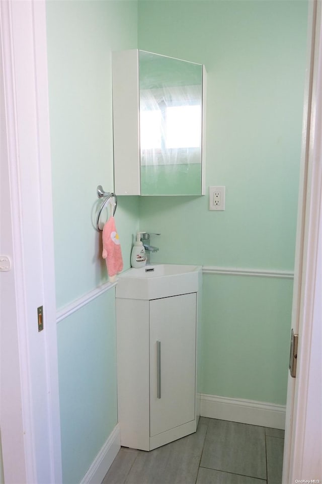 bathroom with tile patterned flooring and vanity