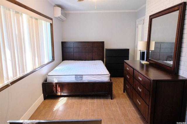 bedroom featuring light hardwood / wood-style floors, a wall mounted air conditioner, and ornamental molding