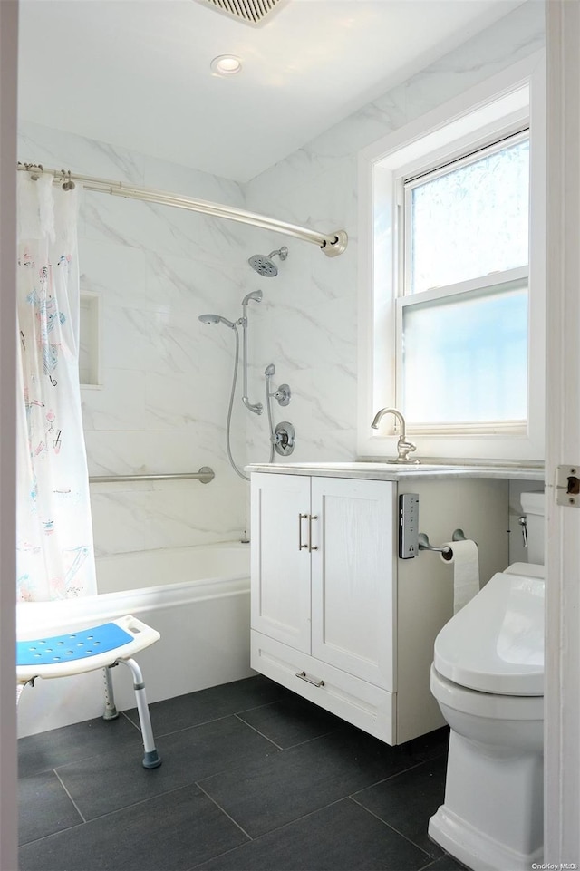 full bathroom featuring tile patterned floors, sink, shower / bathtub combination with curtain, and toilet