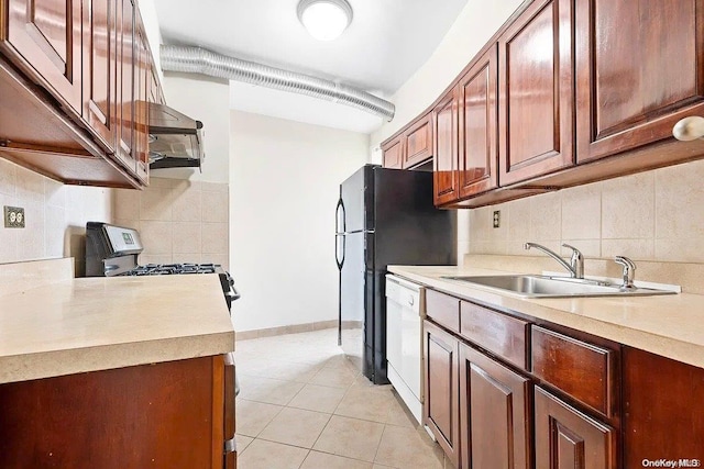 kitchen featuring backsplash, sink, light tile patterned floors, and white appliances