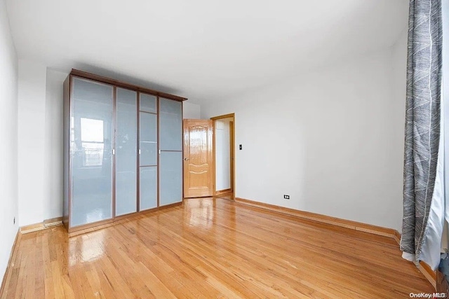 unfurnished bedroom featuring light hardwood / wood-style floors