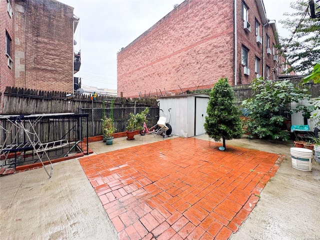 view of patio / terrace with a storage shed