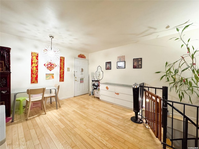 interior space featuring a chandelier and light hardwood / wood-style floors