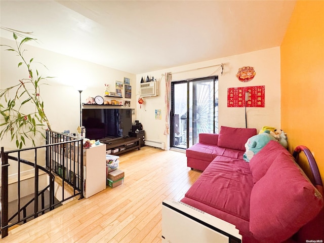 living room with light wood-type flooring, baseboard heating, and a wall mounted AC