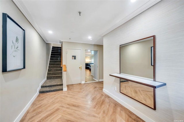 corridor with light parquet floors and ornamental molding