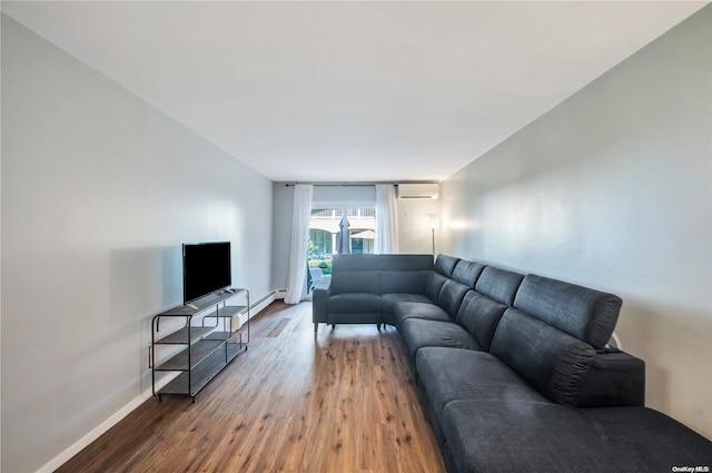 living room with wood-type flooring and an AC wall unit