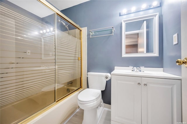 full bathroom featuring tile patterned flooring, vanity, bath / shower combo with glass door, and toilet