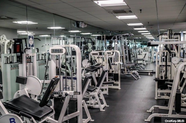 gym featuring a paneled ceiling