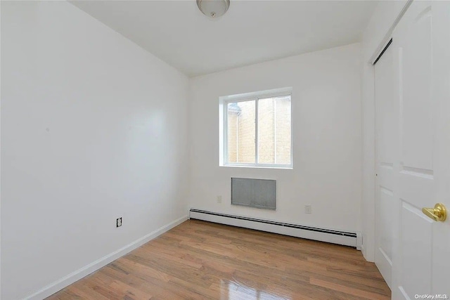 197-21 Carpenter Ave Unit 2G, Jamaica, NY 11423 - empty room featuring light hardwood / wood-style flooring and baseboard heating