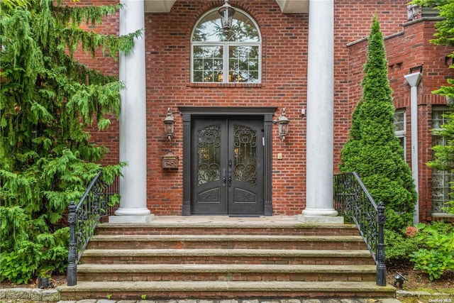 doorway to property featuring french doors and a porch