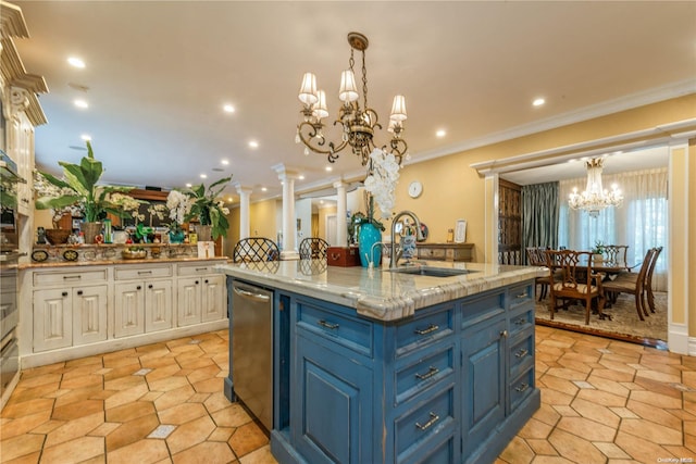 kitchen with blue cabinetry, sink, decorative columns, pendant lighting, and white cabinets