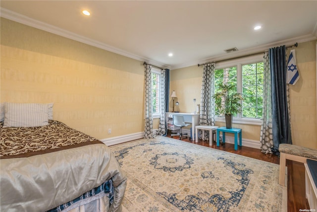 bedroom featuring dark hardwood / wood-style flooring and ornamental molding