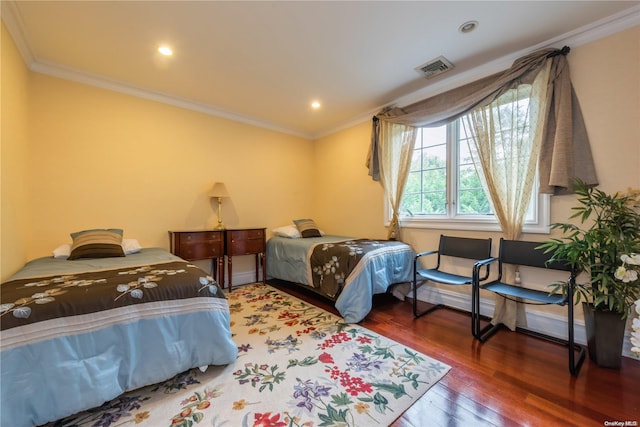 bedroom featuring dark hardwood / wood-style flooring and crown molding