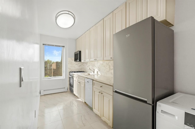 kitchen featuring backsplash, a baseboard heating unit, cream cabinetry, light stone counters, and stainless steel appliances