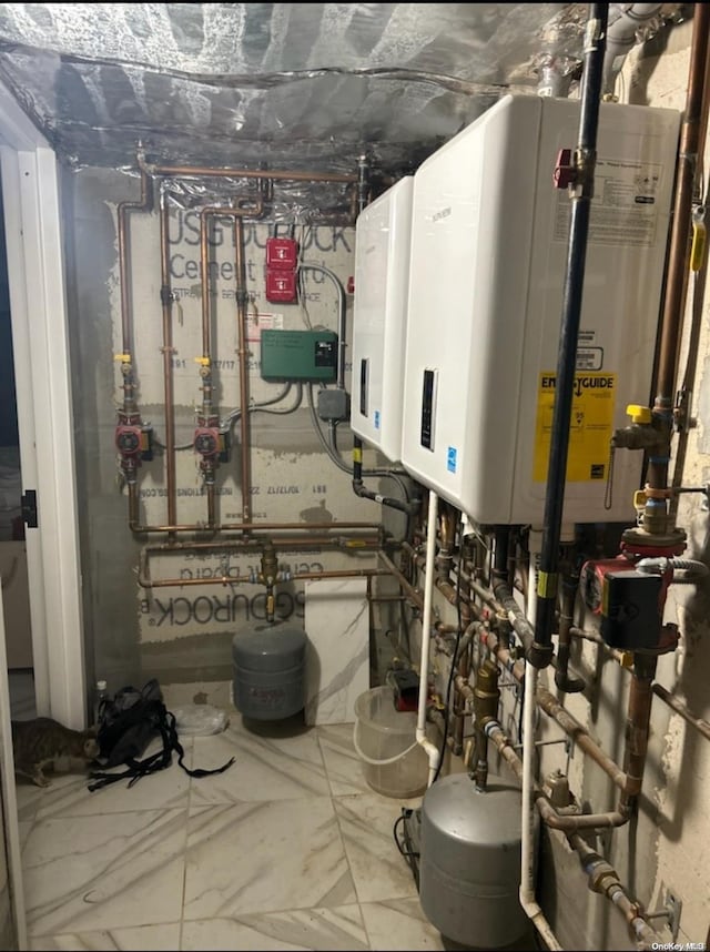 utility room featuring tankless water heater