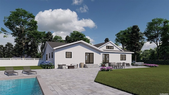 rear view of house featuring a lawn, a patio area, and a fenced in pool