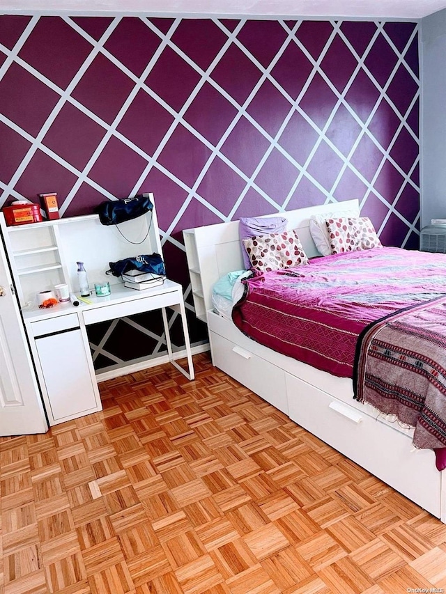 bedroom with light parquet floors