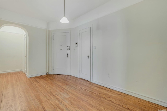 unfurnished room featuring light hardwood / wood-style flooring