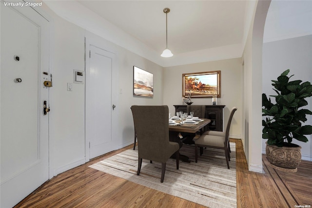 85-10 34th Ave Unit 421, Jackson Heights, NY 11372 - dining area with light wood-style flooring, baseboards, and a raised ceiling