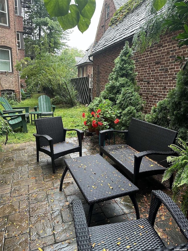 85-10 34th Ave Unit 421, Jackson Heights, NY 11372 - view of patio featuring an outdoor living space