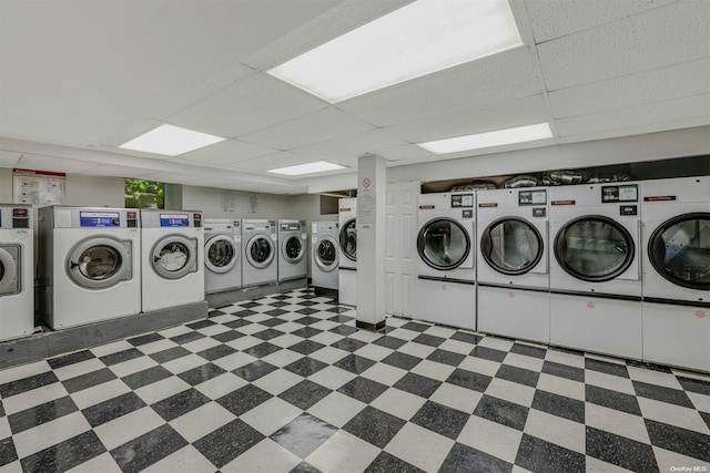 85-10 34th Ave Unit 421, Jackson Heights, NY 11372 - communal laundry room with independent washer and dryer and tile patterned floors