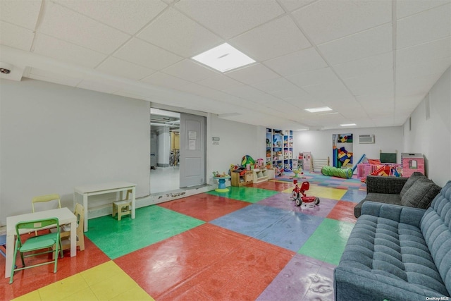 85-10 34th Ave Unit 421, Jackson Heights, NY 11372 - living room featuring a paneled ceiling and tile patterned floors