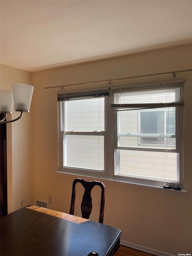 unfurnished office with wood-type flooring