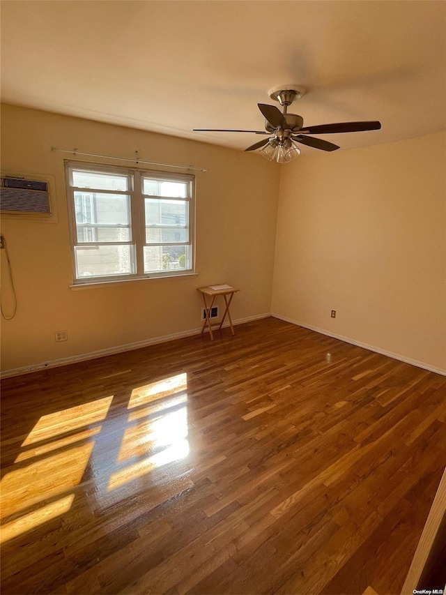 unfurnished room featuring a wall mounted air conditioner, ceiling fan, and dark wood-type flooring