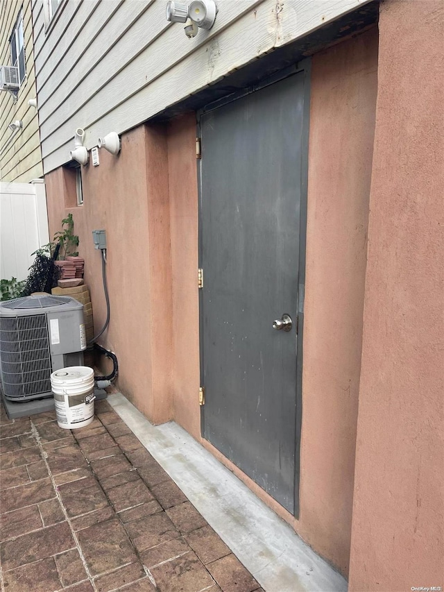 property entrance with central AC unit