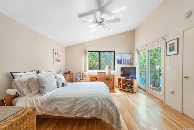 bedroom featuring access to exterior, ceiling fan, light hardwood / wood-style flooring, and multiple windows