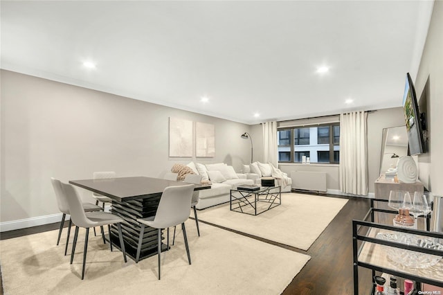 dining space with hardwood / wood-style floors