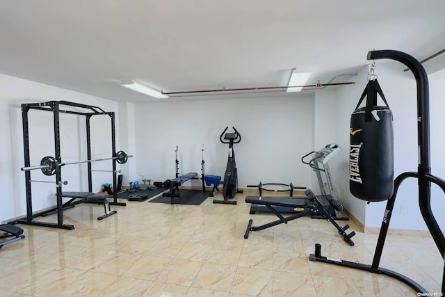 workout room with marble finish floor