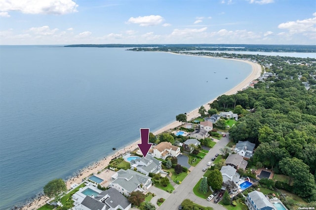 bird's eye view with a water view and a view of the beach