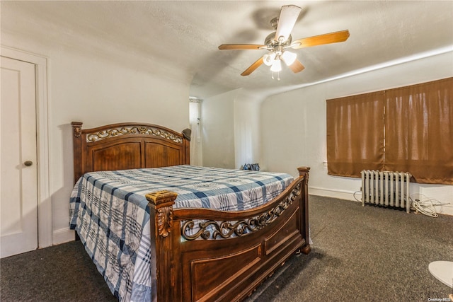 carpeted bedroom with ceiling fan, radiator heating unit, and a textured ceiling