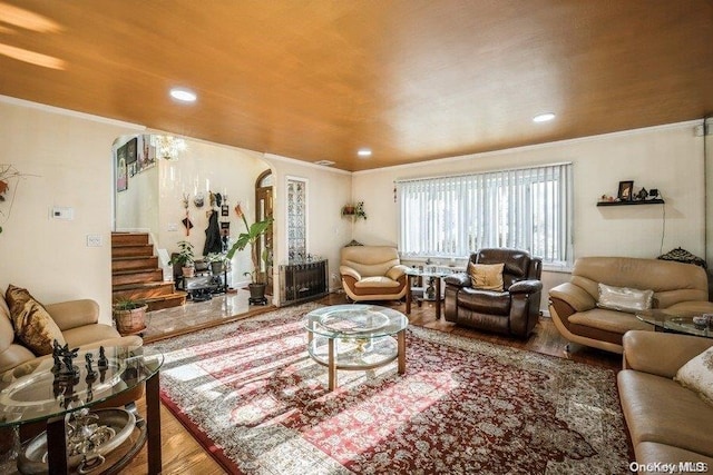 living room with hardwood / wood-style floors and ornamental molding