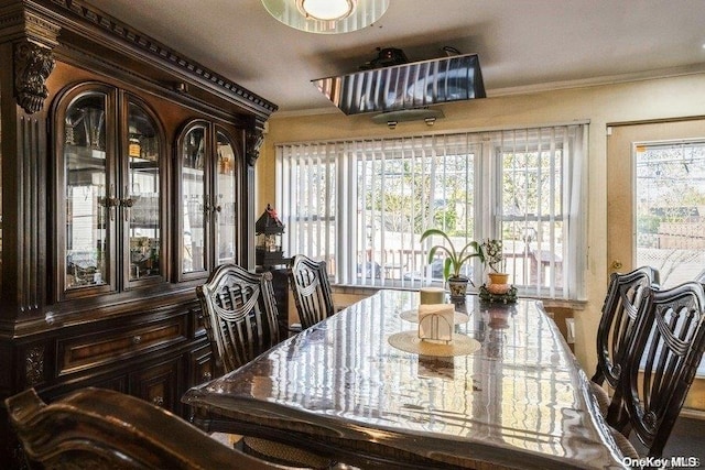 dining area with crown molding