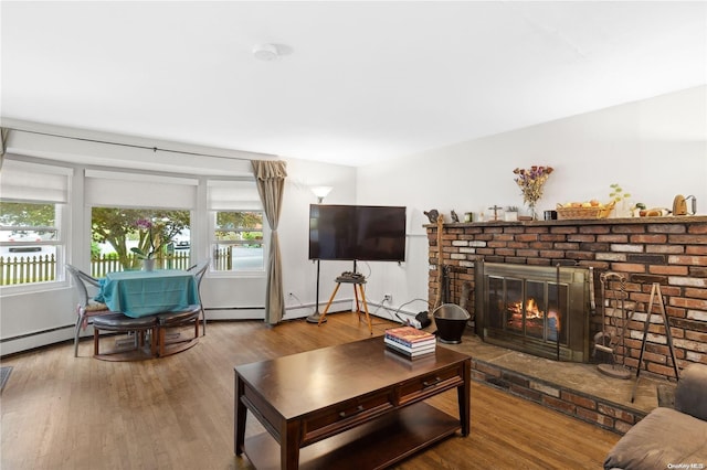 living room featuring a fireplace and hardwood / wood-style flooring