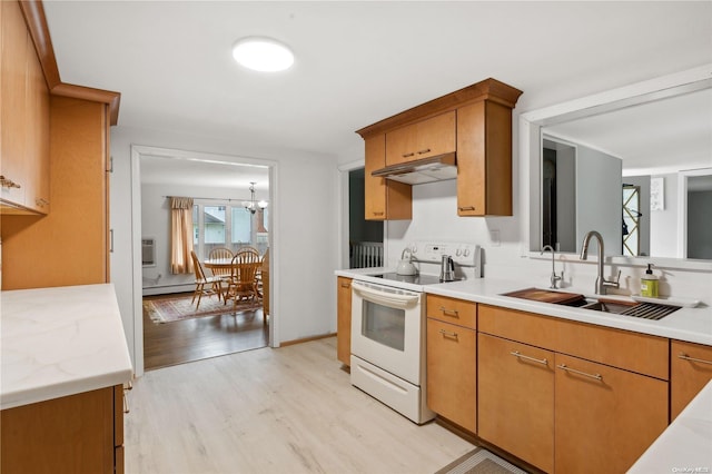 kitchen featuring white range with electric cooktop, light hardwood / wood-style floors, sink, and a chandelier