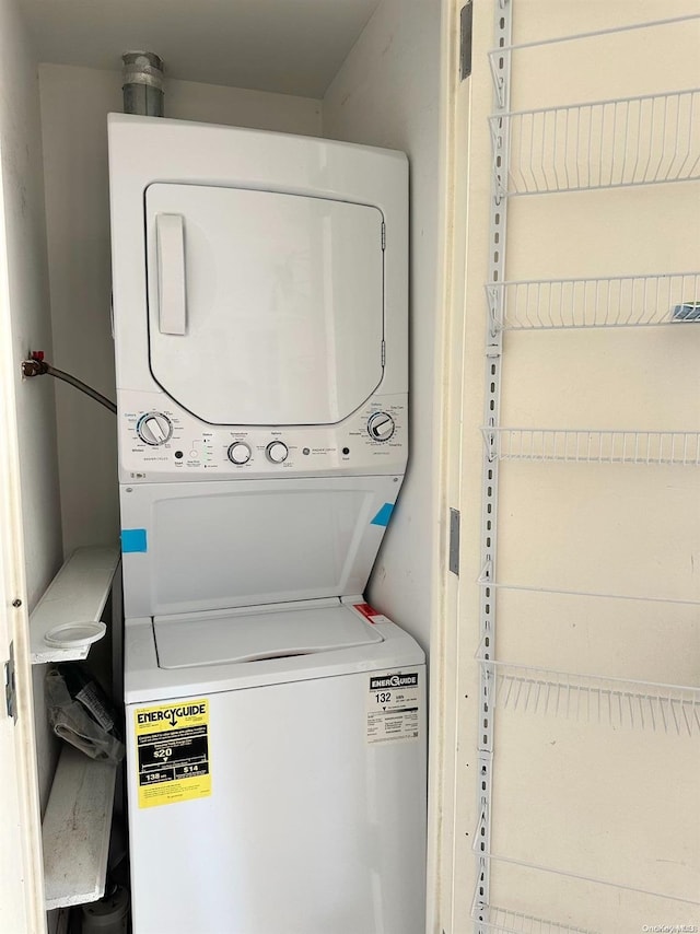 laundry room featuring stacked washer and dryer