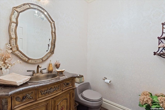 bathroom with vanity and toilet