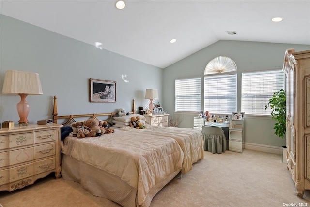 bedroom featuring light colored carpet and lofted ceiling