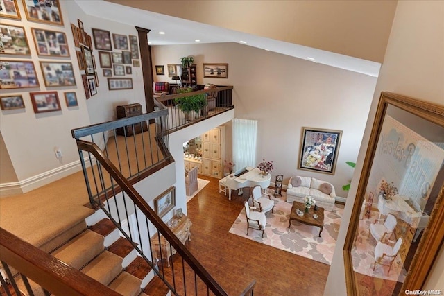 staircase featuring carpet floors