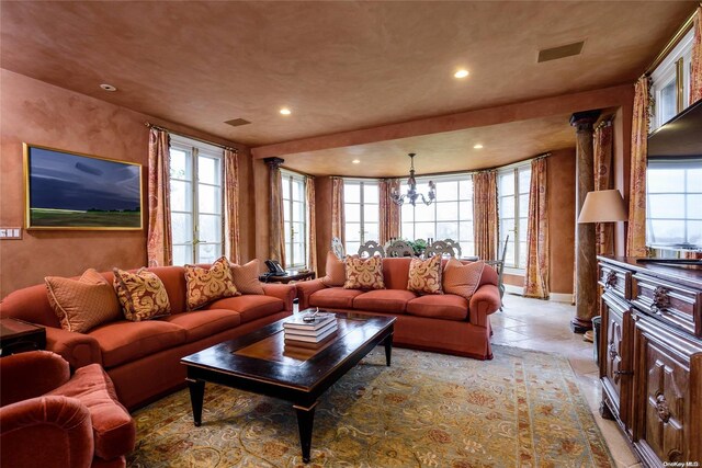 living room with a chandelier and a wealth of natural light